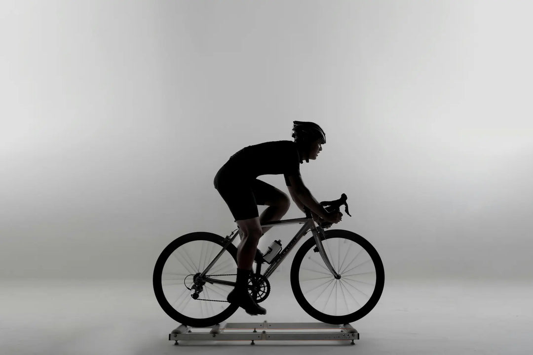 Cyclist riding a road bike on an indoor trainer