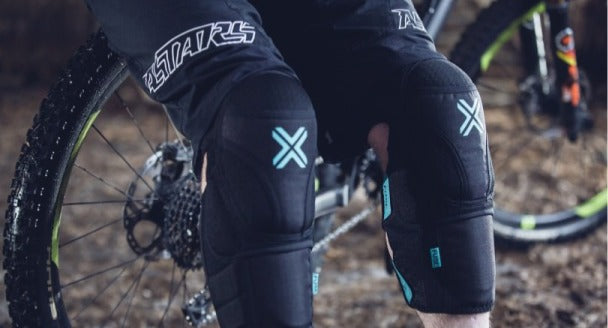 Mountain biker wearing knee pads