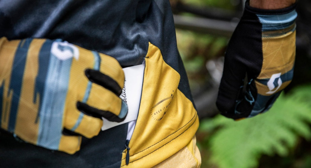 Gravel rider wearing gloves and a waist pack