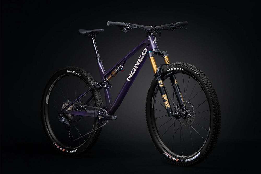 26 Norco Revolver C1 130 Royal Purple Raw Carbon quarter-view product image