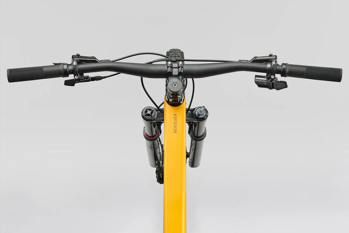 26 Norco Revolver C2 120 Fast Black Raw Carbon Golden Larch cockpit product image