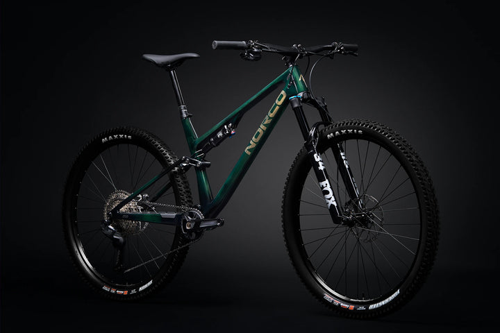 26 Norco Revolver C2 130 Shore Green Raw Carbon quarter-view product image