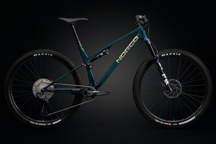 26 Norco Revolver C2 130 Shore Green Raw Carbon side-view product image
